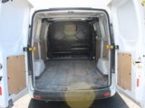 a white van with its doors open in a parking lot