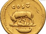 an image of a gold coin with a picture of a man and a cow