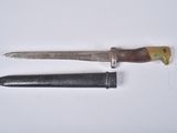 an old knife and a small knife on a white surface