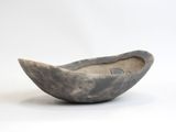 a small bowl that is sitting on a white surface