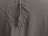 a close up of a shirt with a zipper on the back