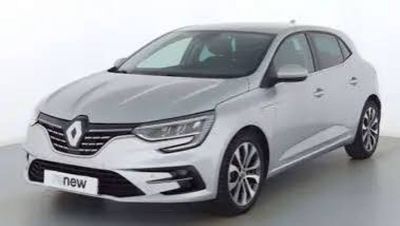 a silver car is parked in a white room