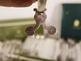 a person holding a pair of scissors in their hand