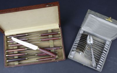 a box with a knife, fork and spoons inside of it