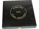 a black box with a gold stamp on the lid
