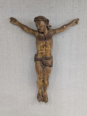 a wooden crucifid hanging on the wall