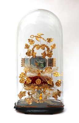 a glass bellow with a clock inside of it