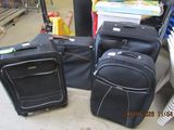 three pieces of luggage sitting on the ground next to each other
