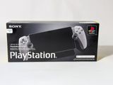 the box of a sony playstation game console with a controller