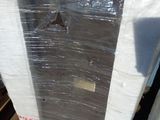 boxes of mattresses are stacked on pallets in a warehouse