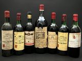 six bouteilles de vin sont alignées sur un fond noir