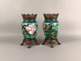 two vases that have been painted with flowers on them