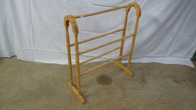 a wooden rack that is sitting on the floor