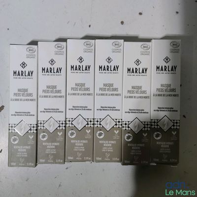 several boxes of marmalay are lined up on a table