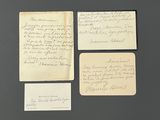 three pieces of paper with writing on them sitting on a table