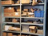 boxes are stacked on a shelf in a room with a refrigerator