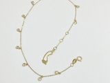 a gold necklace with a chain that has been made from gold beads