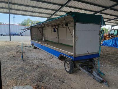 a trailer that is sitting in the dirt
