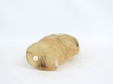 a piece of food that is sitting on a white surface