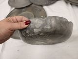 a person that is holding a rock in their hand