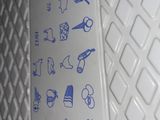 a white board with blue drawings on it sitting on a table