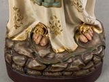 an image of a statue of a woman holding a baby