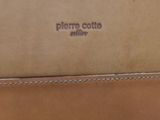 a brown bag sitting on top of a wooden table