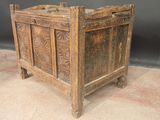 an old wooden chest with carvings on the sides of it