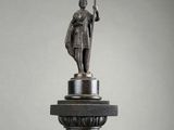 statue of a man holding a staff on top of a column
