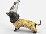 a figurine of a dog wearing a party hat