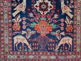 an oriental rug with birds and flowers on a blue background