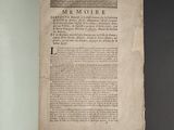 an open book on a table with a black background