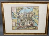 an old map of the city of london in a gold frame