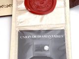 a red wax seal on top of a card holder