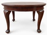 an image of a wooden table with two legs and a round top