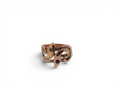 a close up of a ring on a white surface