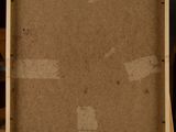 an empty wooden easel with a piece of cardboard on top of it