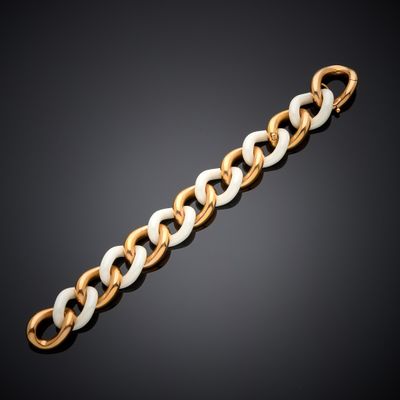 a gold and white link bracelet