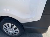 a close up of a white car with a black rim