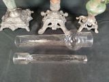 three glass candlesticks and a candle holder on a table
