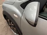 a close up of a car ' s side mirror on the side of the road