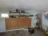 an image of a room with a lot of clutter and tools