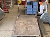 an image of a dolly truck in a warehouse