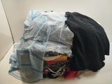a pile of clothes sitting on top of a white table