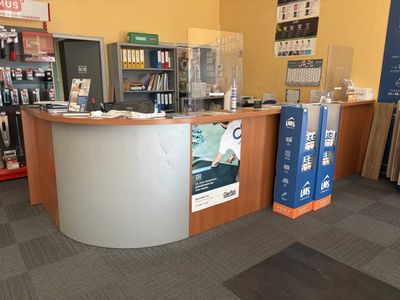 a picture of a store with a counter and a display case