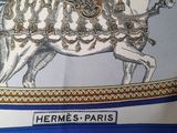 blue and white pillow with a picture of a horse and carriage on it