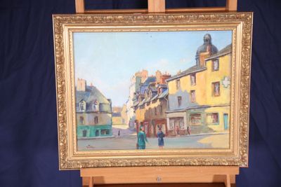 a painting of a street scene on a easel