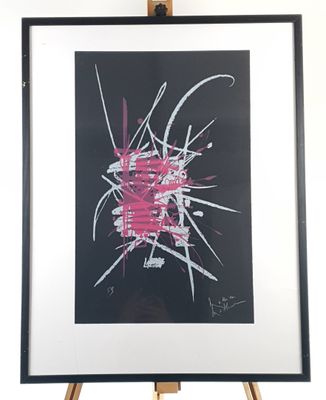 painting on a easel with a black background and a pink and white design
