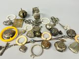 a pile of assorted silver items on a table