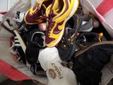 many pairs of shoes in a bag that is full of them